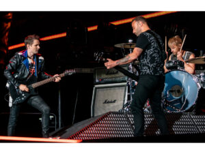 Matthew Bellamy, Christopher Wolstenholme e Dominic Howard, integrantes do Muse